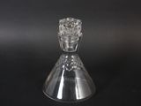 a clear glass vase with a flower inside of it