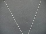 sterling silver necklace with a square shaped pendant on a silver chain