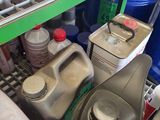 a shelf filled with various containers and containers of liquid