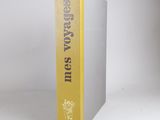 the book is sitting on a white surface with a yellow cover