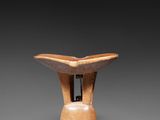 an image of a wooden vase on a grey background