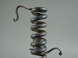 a metal sculpture that has a spiral design on it
