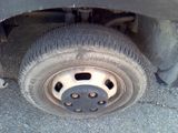 a close up of a flat tire on a truck