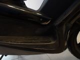 a close up of a black motorcycle with a white background