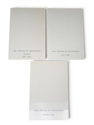 a couple of white paint samples sitting on top of each other