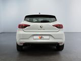 the rear end of a white car in a white room