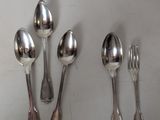 five spoons and two spoons on the table