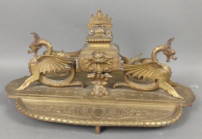 a gold plate with a bird and a bird on it