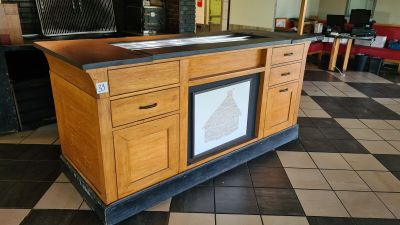 a kitchen island with a sink and a stove in it