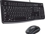 a computer keyboard and mouse sitting next to each other