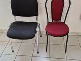 two chairs sitting next to each other on a tiled floor