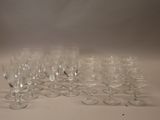 many empty wine glasses sitting on a white table
