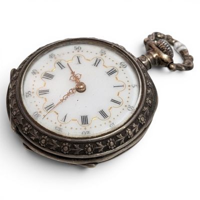 a pocket watch with roman numerals on the face