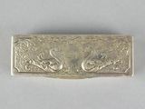 silver plated business card case with a dragon design on the front