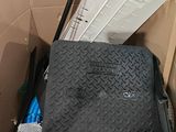 a black suitcase sitting in a box with other items