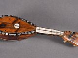 a small wooden instrument that is sitting on a table