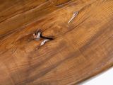 a wooden sculpture of a whale on a white surface