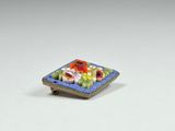 a small blue plate with fruit on it on a white surface