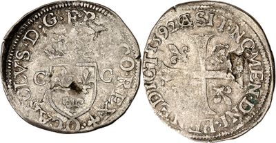 a silver coin with a shield on the front and a shield on the back