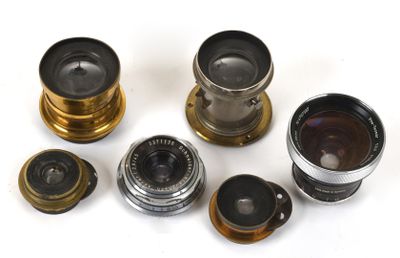 several different types of camera lenses sitting on top of each other