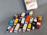a lot of toy cars and a book on the table