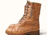 brown leather boots with zippers and laces on a white background