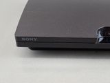 a sony playstation game console sitting on a table