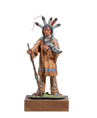 statue of a native american man with a rifle and a rifle