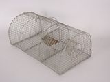 a small metal cage with a bird inside of it