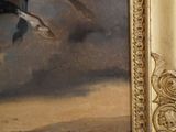 a painting of a man riding a horse in the desert