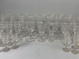 a lot of empty wine glasses sitting on a table