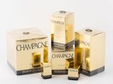 three bottles of champagne sitting next to each other on a white surface
