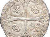 an old silver coin with a cross on it
