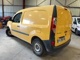 a yellow van that is parked in a garage