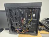 a computer with many wires in it on a desk