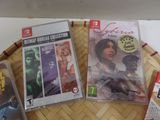 three video games sitting on a tray on a table