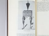 an open book with a picture of a man holding an umbrella
