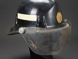 an image of a helmet with a visor on a black base