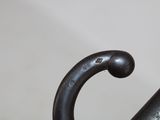 a close up of a black umbrella with a metal handle