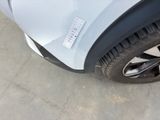 a white car with a sticker on the side of it