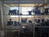 many pots and pans on the shelves in the room