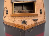 a small model of a boat on display on a table