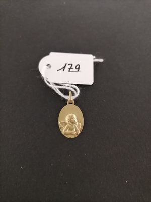a gold coin with a small dog on it ' s side