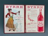 un vieux livre sur lequel figure l'image d'une femme tenant un verre de vin