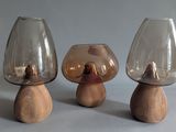 three glass vases sitting on top of each other