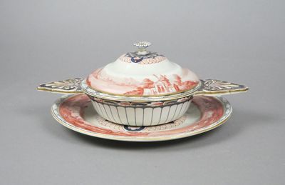 a white and red bowl and saucer on a saucer