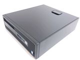 a black desktop computer sitting on a white surface