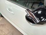 a car with a helmet on the side of it