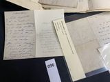 some old papers are sitting on top of a black table