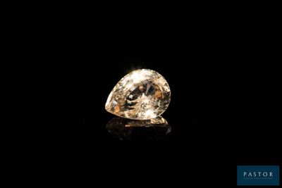 a yellow diamond on a black background